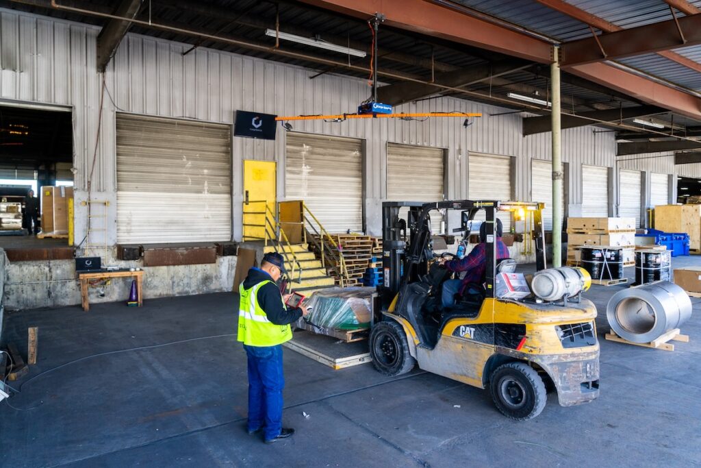 Warehouse workers at the loading dock using Cargo Spectre freight dimensioner software